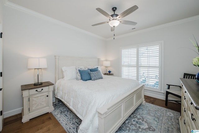 bedroom with baseboards, crown molding, visible vents, and dark wood-style flooring