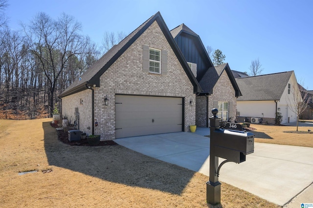 view of front of property with board and batten siding, concrete driveway, brick siding, and an attached garage