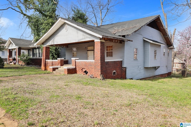 view of home's exterior with a lawn