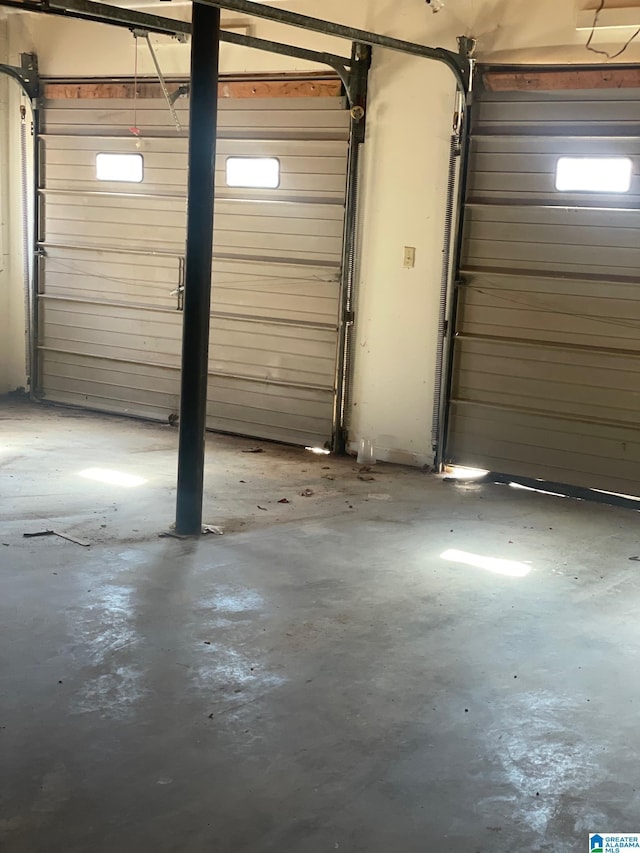 garage featuring wood walls