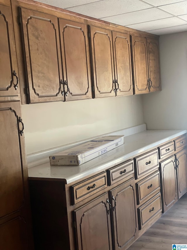 kitchen with wood finished floors and light countertops