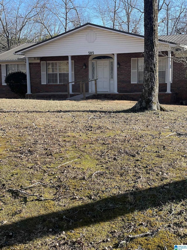 view of front of property featuring brick siding