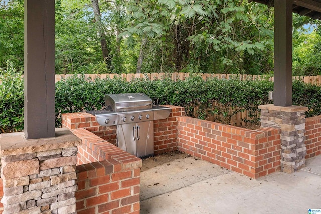 view of patio / terrace featuring fence