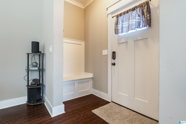 foyer with baseboards, dark wood-style flooring, and ornamental molding