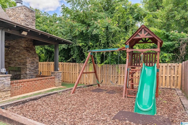 view of playground with a fenced backyard