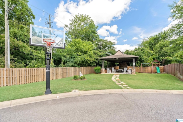 exterior space with a playground, a yard, a gazebo, and a fenced backyard