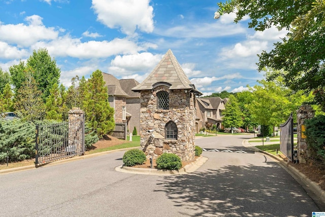 exterior space with driveway and fence