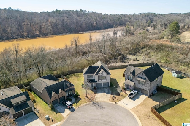 bird's eye view featuring a wooded view