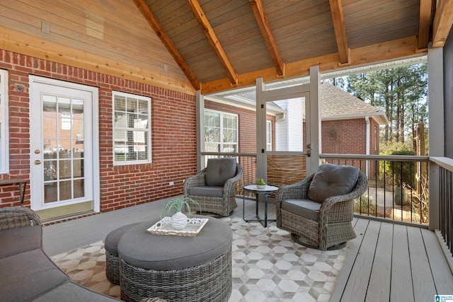 sunroom / solarium with wood ceiling and vaulted ceiling with beams