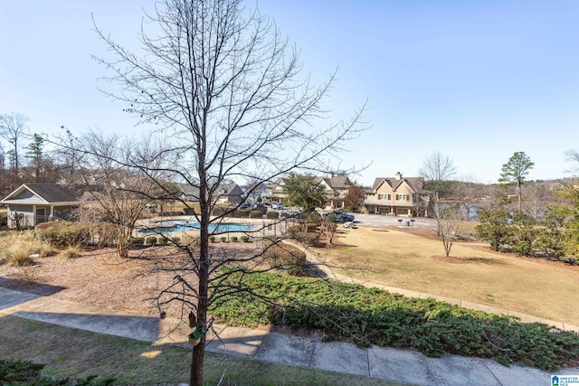 view of yard featuring a community pool