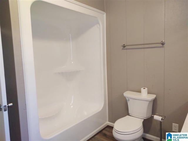 bathroom with toilet and hardwood / wood-style floors