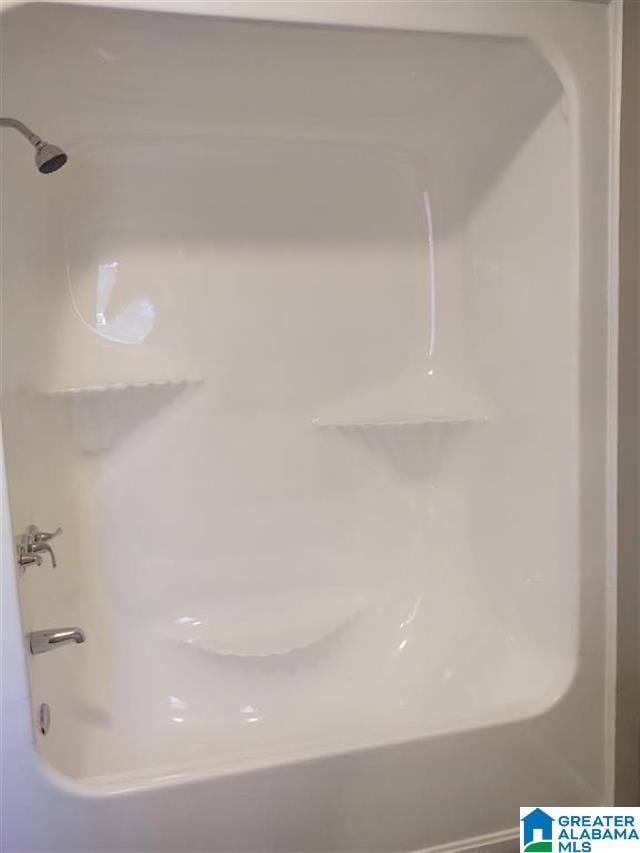 details featuring shower / tub combination