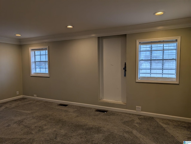 unfurnished room featuring carpet and ornamental molding