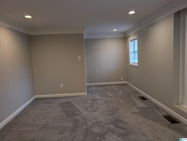 carpeted empty room featuring crown molding