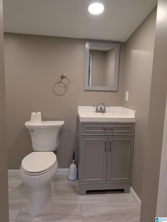 bathroom with toilet and vanity