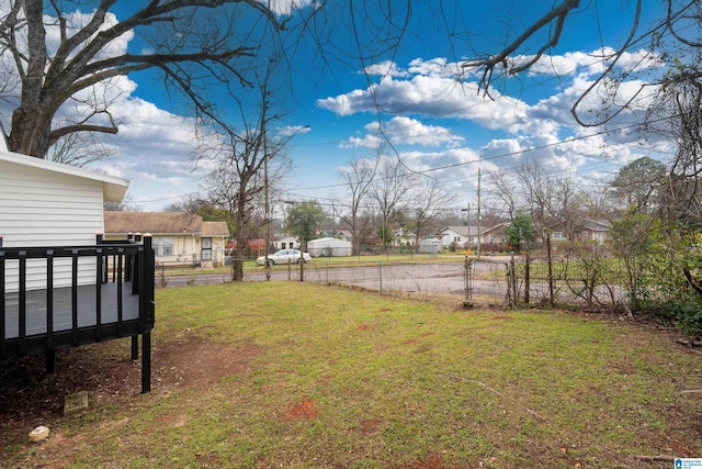 view of yard with a residential view and fence