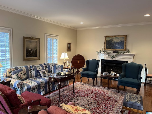 living room with crown molding, recessed lighting, a fireplace, and wood finished floors