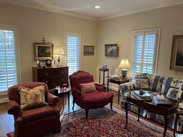 living area featuring recessed lighting, wood finished floors, a wealth of natural light, and crown molding