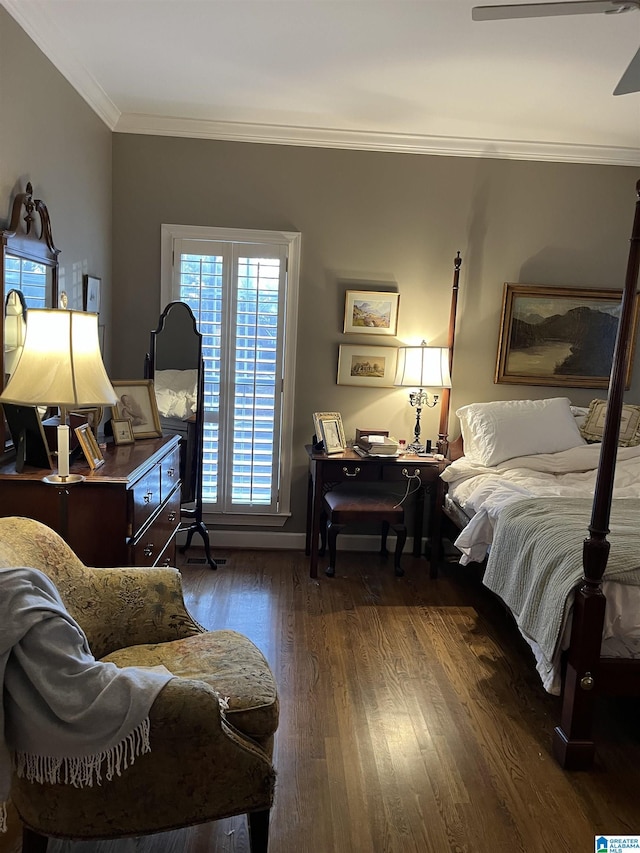 bedroom featuring ornamental molding and wood finished floors