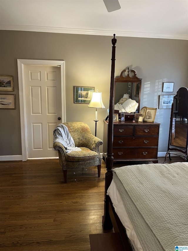 bedroom with baseboards, ceiling fan, dark wood-type flooring, and crown molding