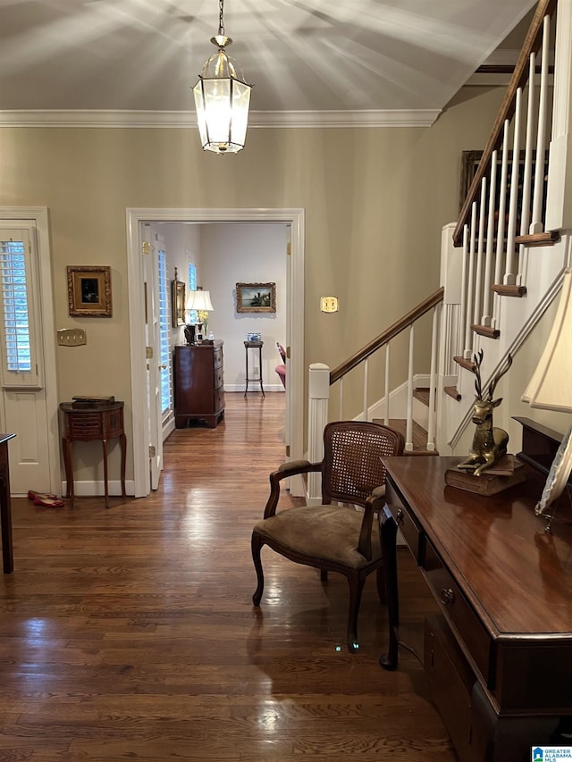 entryway with crown molding, stairway, baseboards, and wood finished floors