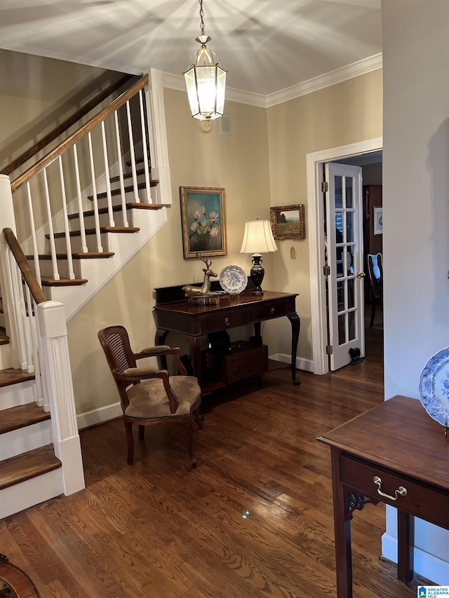 interior space featuring stairs, crown molding, baseboards, and wood finished floors