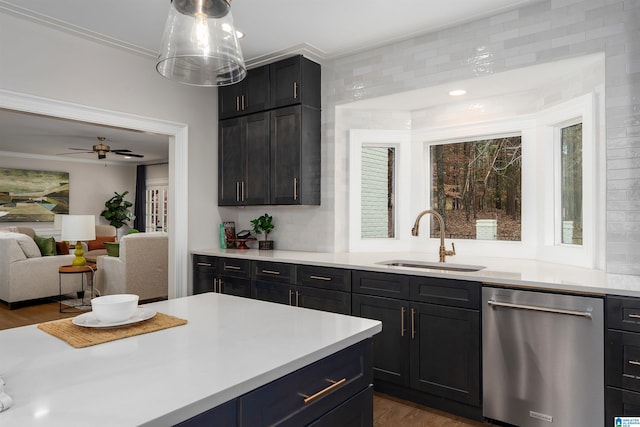 kitchen with dishwasher, light countertops, and a sink