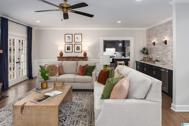 living room with a ceiling fan, recessed lighting, crown molding, and wood finished floors