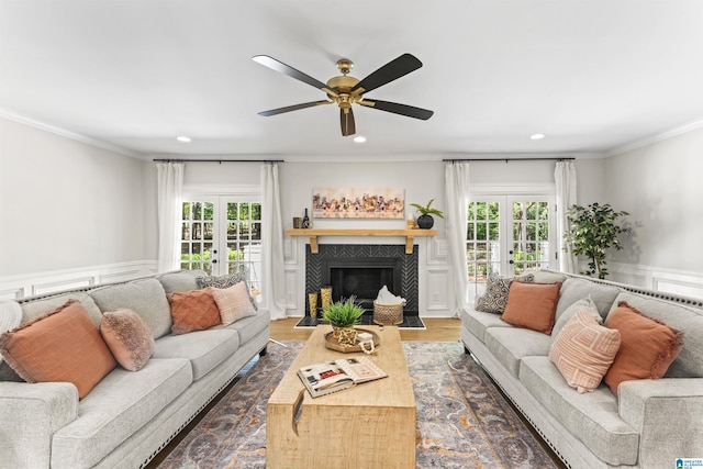 living area featuring ornamental molding, a wealth of natural light, french doors, and dark wood-type flooring