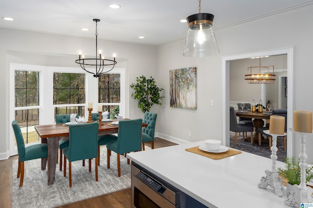 dining area with baseboards, recessed lighting, dark wood finished floors, and a notable chandelier