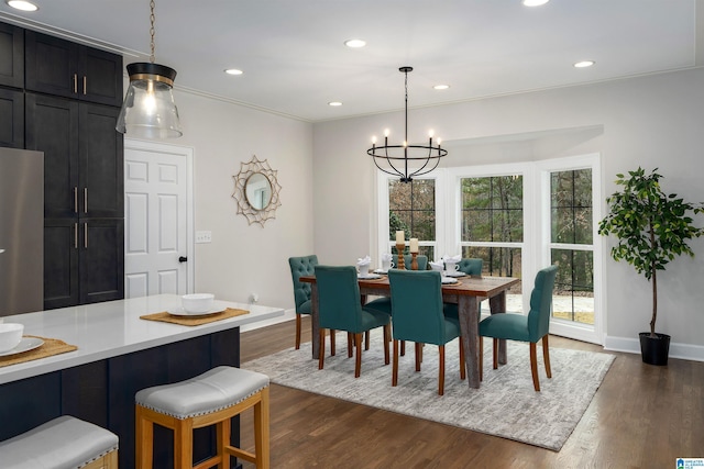 dining area featuring baseboards, dark wood-type flooring, an inviting chandelier, and recessed lighting