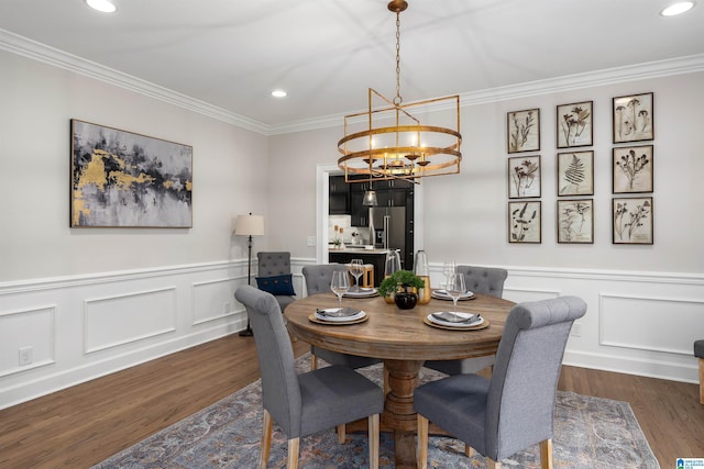 dining area featuring ornamental molding, recessed lighting, a chandelier, and dark wood finished floors