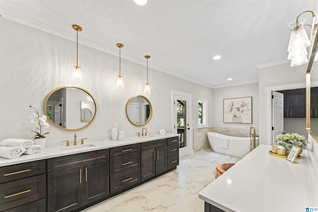 bathroom with a freestanding tub, marble finish floor, a sink, and double vanity