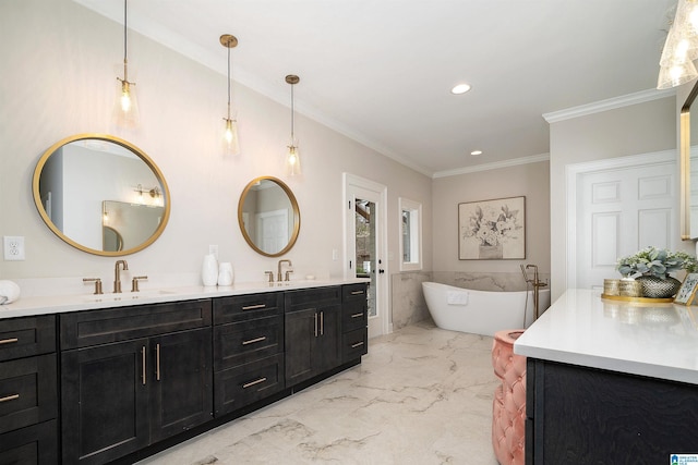 full bathroom with marble finish floor, ornamental molding, a sink, and a soaking tub