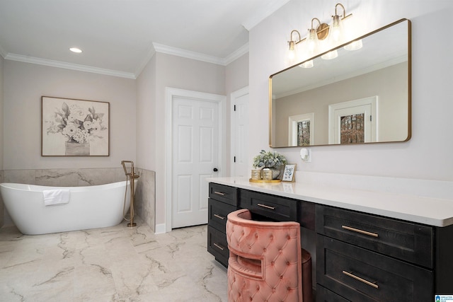 bathroom featuring marble finish floor, crown molding, recessed lighting, a freestanding bath, and vanity