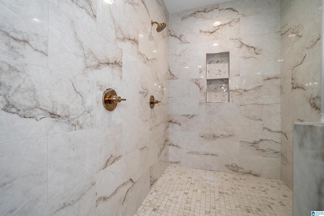 full bath featuring a tile shower