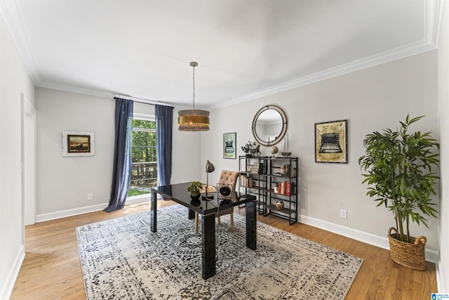 office featuring light wood finished floors, baseboards, and ornamental molding