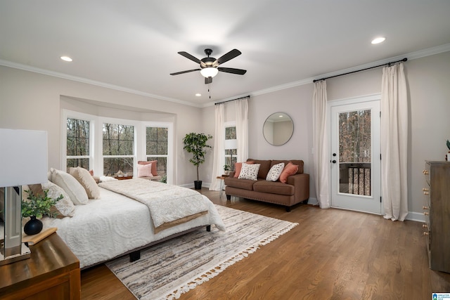 bedroom with access to outside, ornamental molding, wood finished floors, and recessed lighting