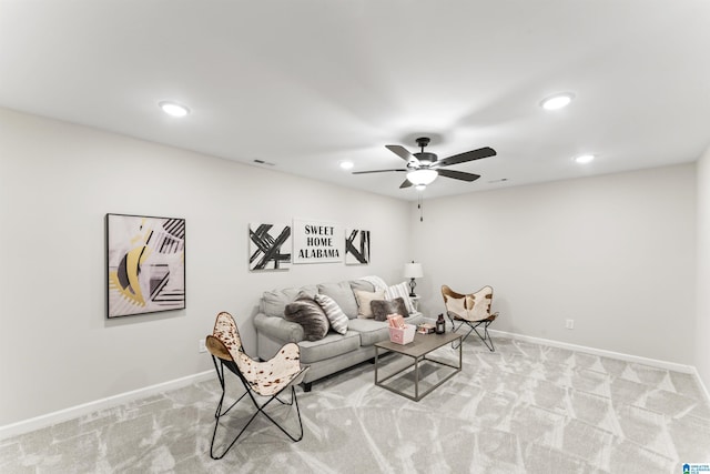 living room with recessed lighting, light colored carpet, ceiling fan, and baseboards