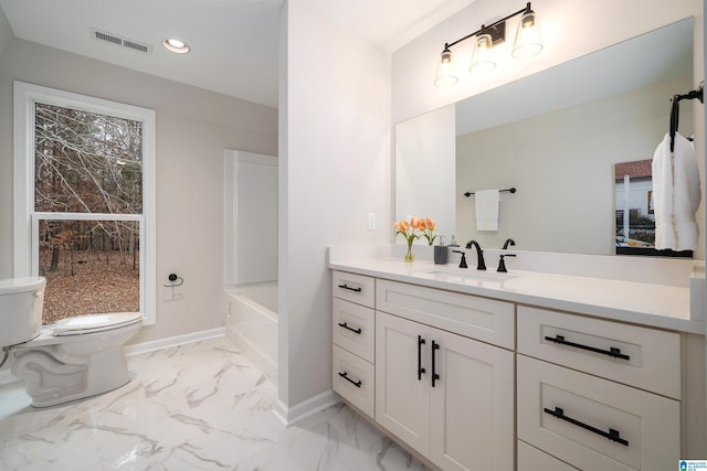 bathroom featuring toilet, vanity, visible vents, baseboards, and marble finish floor