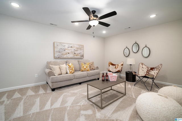 living area with light carpet, baseboards, visible vents, and recessed lighting