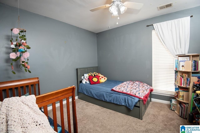 carpeted bedroom with ceiling fan