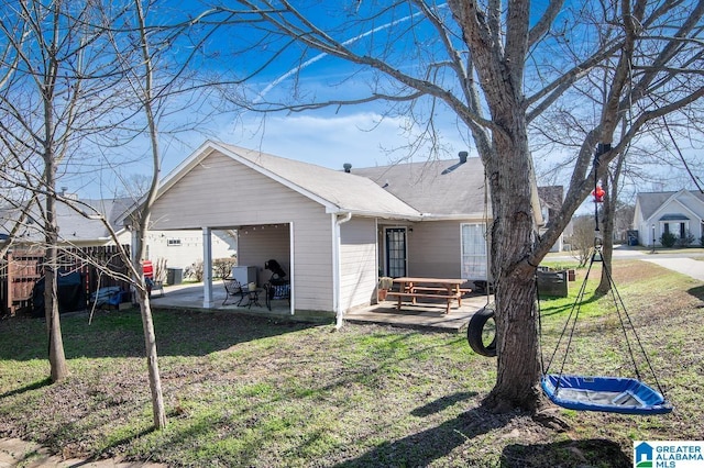 view of property exterior featuring a yard and a patio area