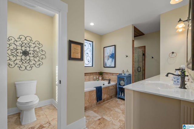 bathroom with a garden tub, toilet, vanity, baseboards, and a shower stall