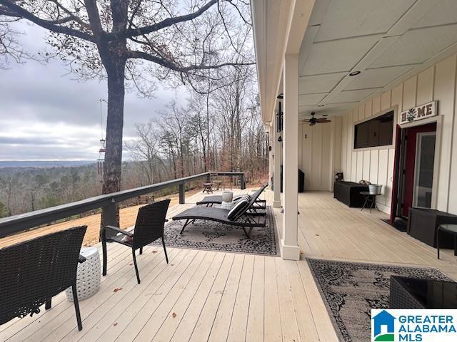 wooden deck with ceiling fan