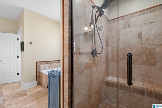 full bath with a shower stall