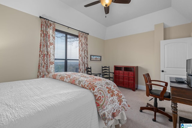 bedroom with a ceiling fan, carpet, and lofted ceiling