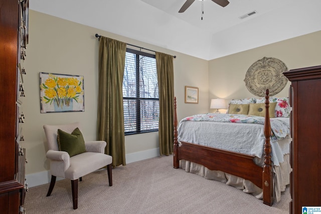 bedroom with light carpet, baseboards, visible vents, lofted ceiling, and ceiling fan