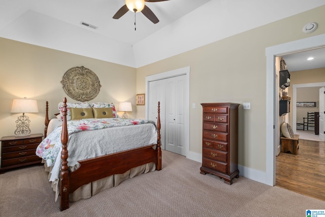 bedroom featuring carpet flooring, a ceiling fan, visible vents, baseboards, and a closet