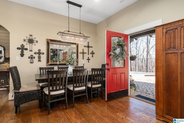 dining room featuring visible vents and wood finished floors